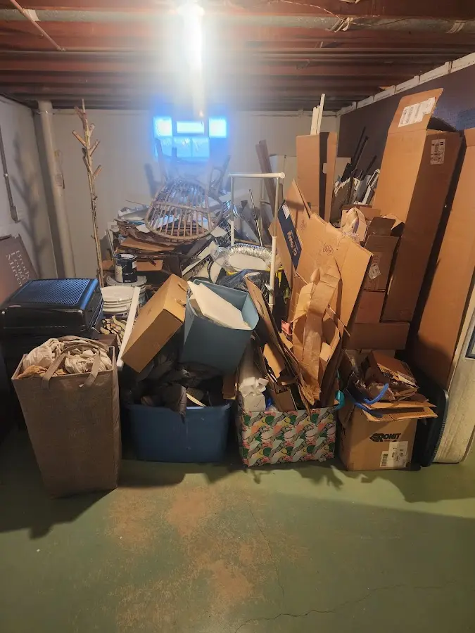 Roll-off dumpster container at job site for 8 Yard Dumpster Rental in Millis